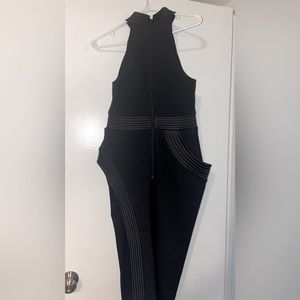 Black styled dress. Medium. The dress has sheer material on each side